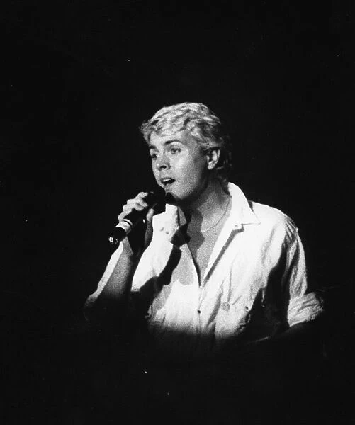 Mike Nolan of Bucks Fizz sings a solo during concert at the Night Out, Birmingham