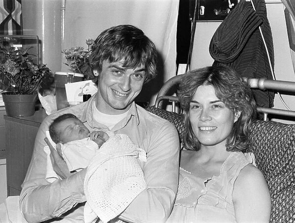 Mike Oldfield, musician and composer, pictured with newborn baby daughter Molly
