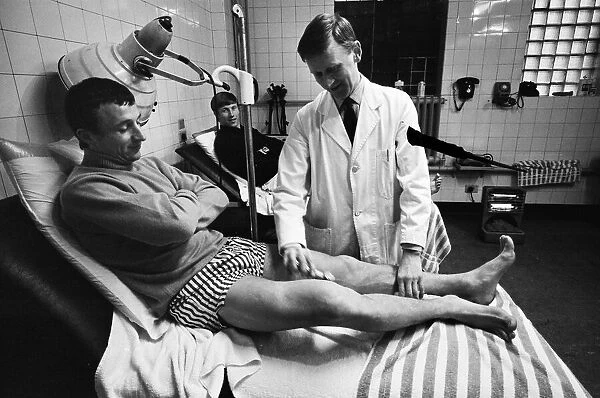 Mike Summerbee being examined (far left) whilst Colin Bell (right) awaits treatment