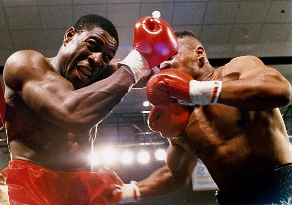 Mike Tyson vs. Frank Bruno for the WBA, WBC, IBF and lineal heavyweight championships