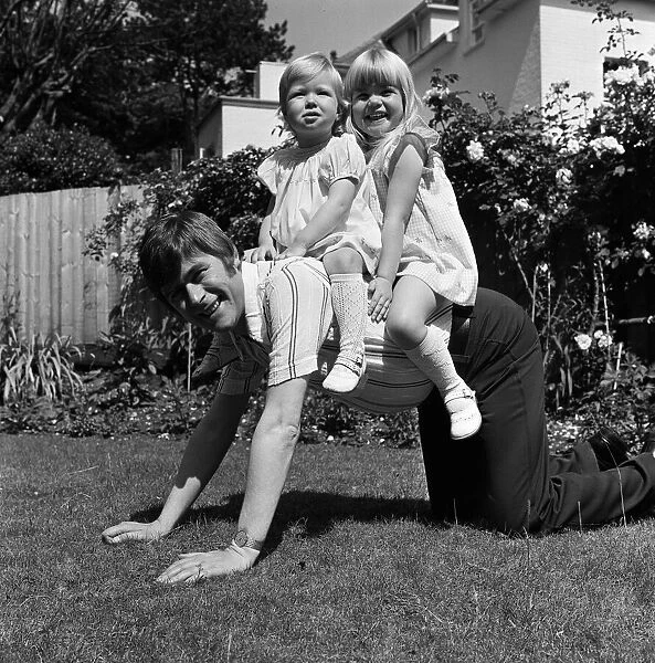 Mike Yarwood with his daughters Charlotte and Claire. 8th July 1974