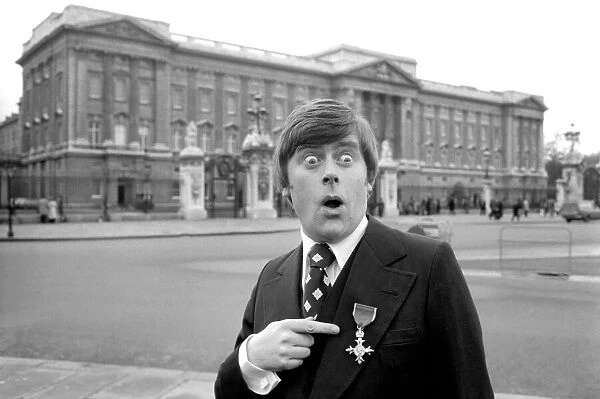 Mike Yarwood outside Buckingham Palace after receiving the O. B. E. December 1976