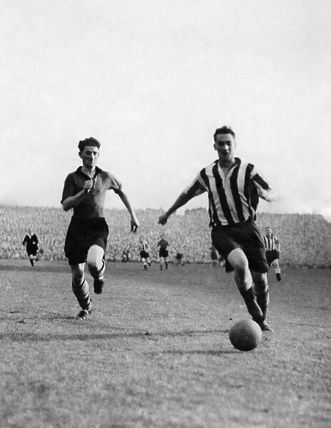 Here is Milburn about to score the first of his two great goals for Newcastle United