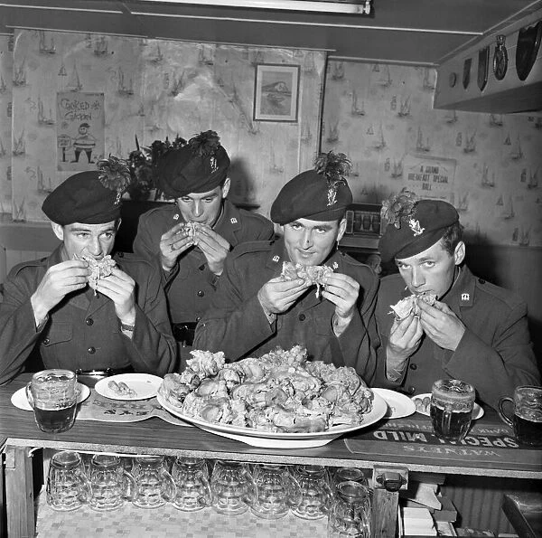 Military Army Food. Soldiers of the Irish Rangers eating pigs trotters in the London Inn
