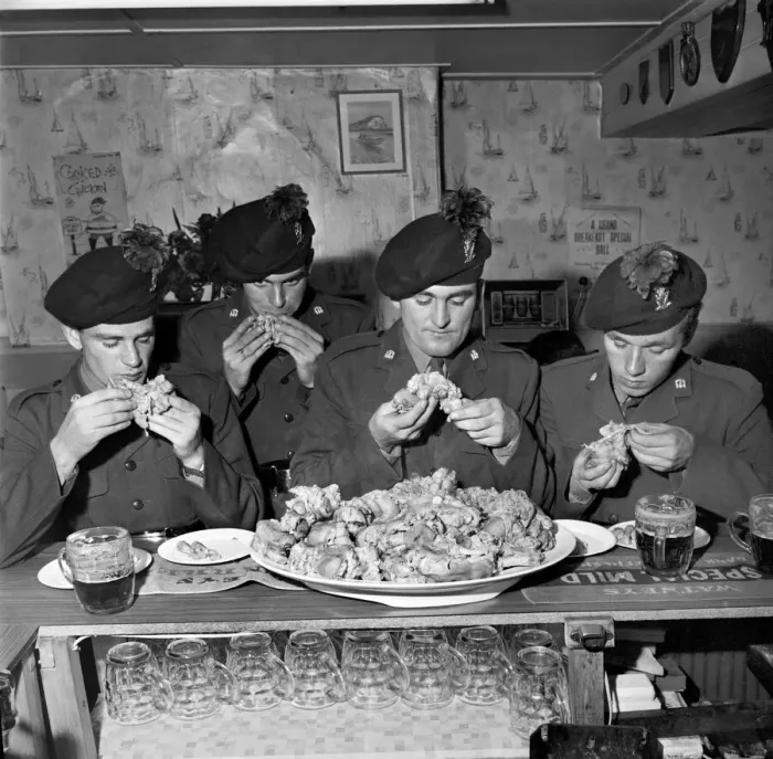 Framed Print : Military Army Food. Soldiers of the Irish Rangers eating pigs trotters in the London Inn