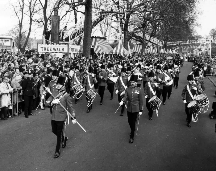 Framed Print : A military band leads the Battersea Easter Parade of 1971 as crowds gather to watch Framed Print : A military band leads the Battersea Easter Parade of 1971 as crowds gather to watch