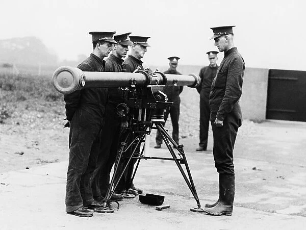Militiamen seen here being given training in the use of an artillery rangefinder at a