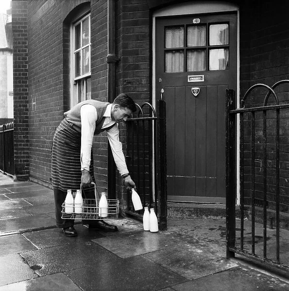 Milkman making doorstep delivery, January 1966