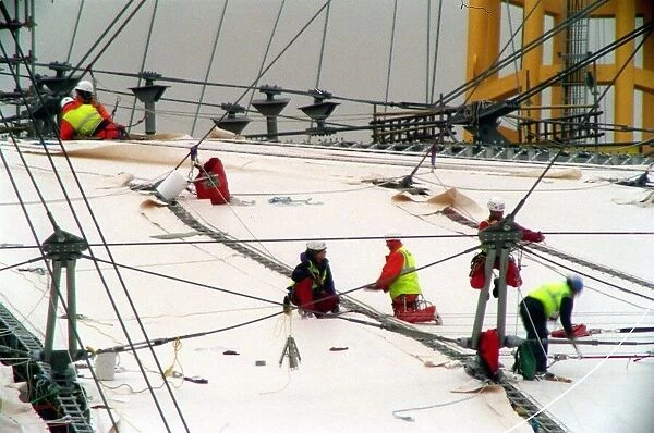Millennium Dome Greenwich. April 1998 Workmen start to stretch the cover over