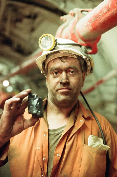 A miner below ground at Cotgrave Colliery for the final shift before the mine is closed