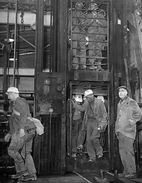 Miners coming off shift at Hamstead Colliery, West Bromwich to the news that the mine is