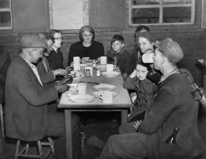Framed Print : Miners straight from the coal face sitting down with women Framed Print : Miners straight from the coal face sitting down with women