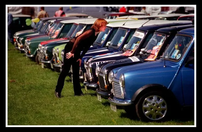 Framed Print : Mini car August 1999 Woman looking at blue Minis Mini cars are at Silverston for 40th Framed Print : Mini car August 1999 Woman looking at blue Minis Mini cars are at Silverston for 40th