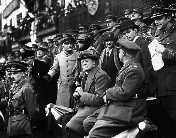 Minister of Munitions Winston Churchill watches the march past of the 47th Division in
