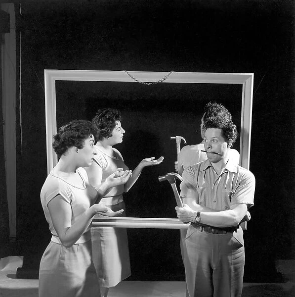 Mirror image: A couple argue in front of a mirror. 1958