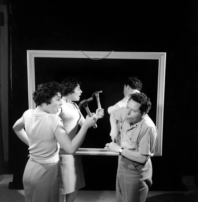 Framed Print : Mirror image: A couple argue in front of a mirror. 1958 Framed Print : Mirror image: A couple argue in front of a mirror. 1958