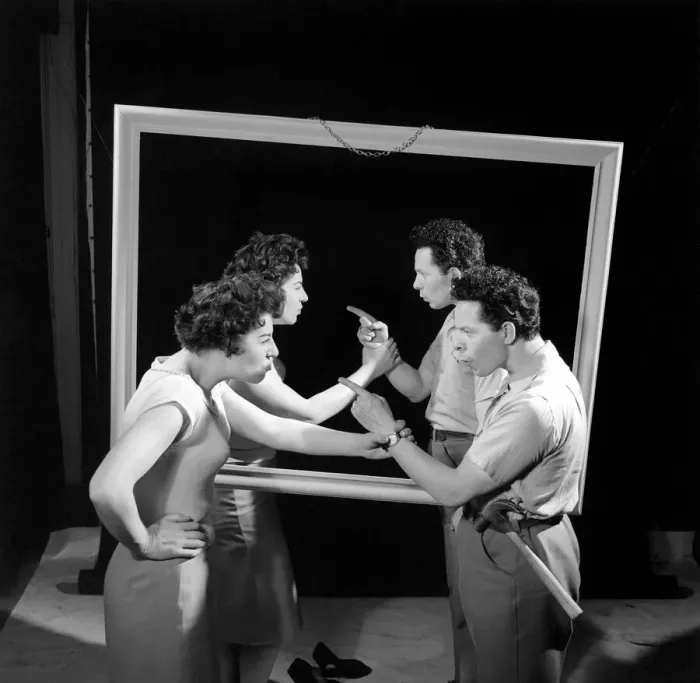 Framed Print : Mirror image: A couple argue in front of a mirror. 1958 Framed Print : Mirror image: A couple argue in front of a mirror. 1958