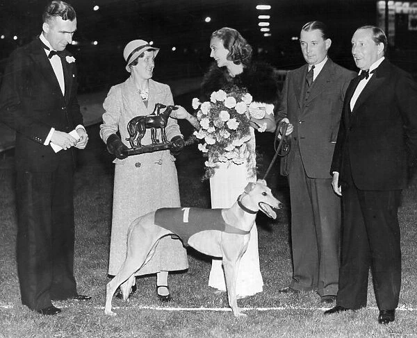 Miss Betty Davis holding bouquet star of City Films presenting the Daily Mirror £