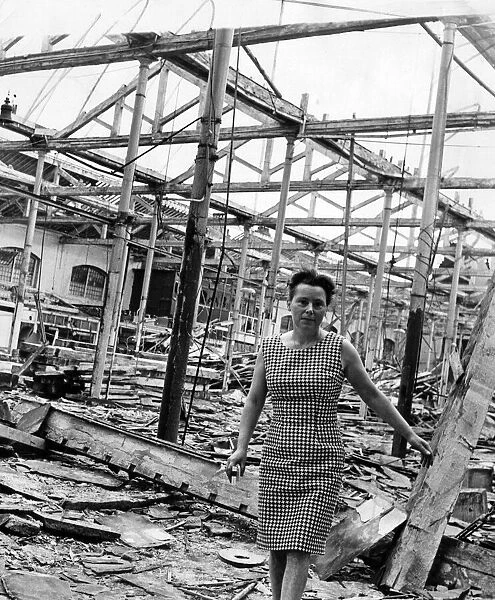 Miss Eileen Harris standing in the rubble which was once St. Johns Market, Liverpool