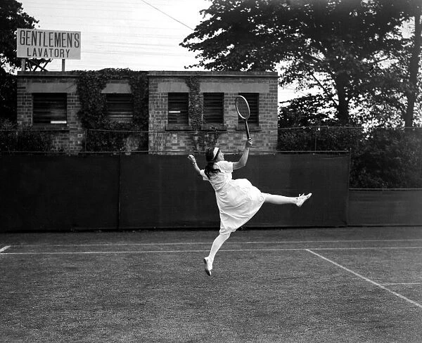 Miss Evelyn. L. Colyer playing tennis at Wimbledon June 1923