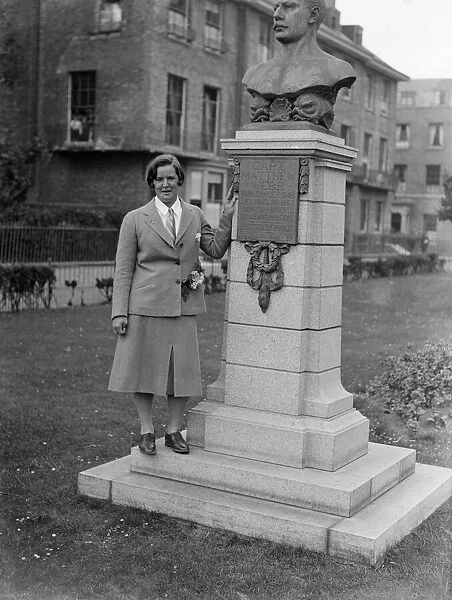 Miss Gertrude Ederle, American swimming champion, by the statue of Captain Webb