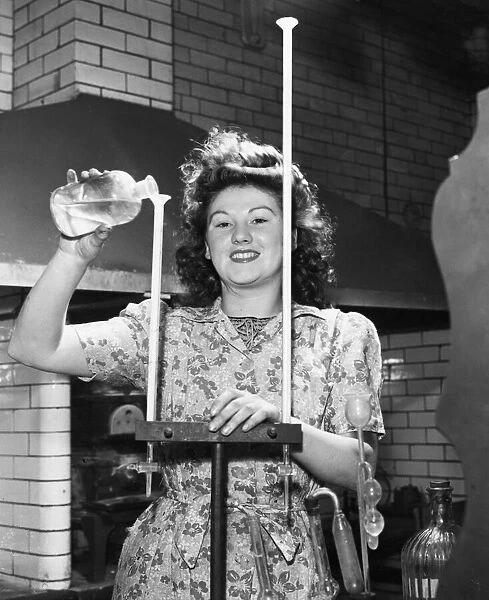Miss Joyce Richardson, aged 21 of Rotherham, South Yorkshire at work as a junior chemist