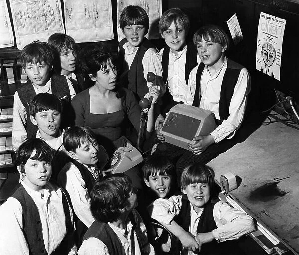Miss Marti Webb, surrounded by Fagins gang from the cast of Oliver