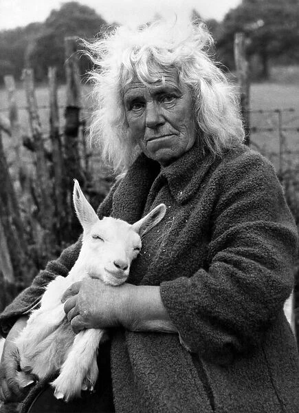 Miss Thompson with Miranda - one of her 50 goats. December 1954 P011772