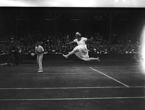 Mlle Suzanne Lenglen and G L Patterson in the mixed doubles at the Tennis Championships