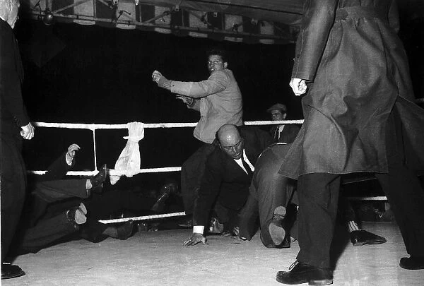 Mob invaded the ring after champion Dick Richardson had retained his European heavyweight
