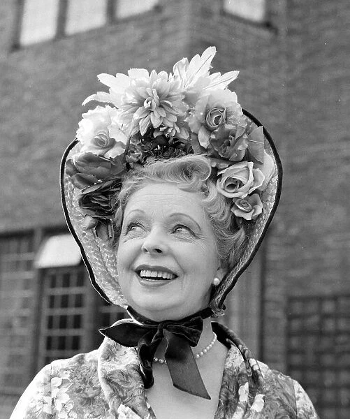 Model and actress Iris Greenwood of Chelsea, aged 63 wearing a bonnet March 1959