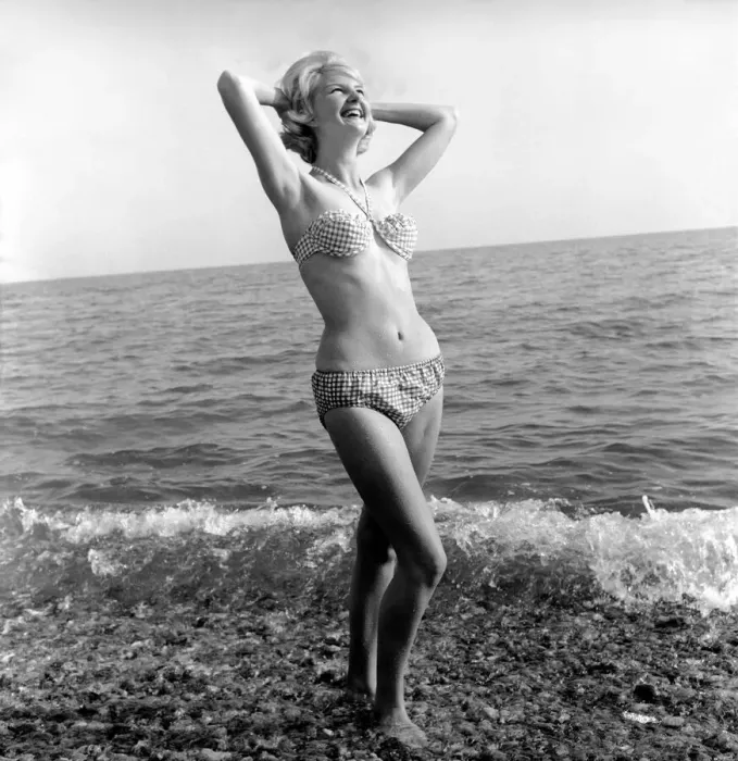 Framed Print : Model Angela Williamson on the beach. June 1960 M4326