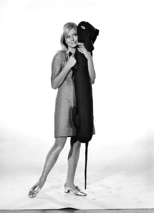 Framed Print : Model Anna Maria Greaves with Roly dog soft toy and draft excluder. 1959 D169-013 Framed Print : Model Anna Maria Greaves with Roly dog soft toy and draft excluder. 1959 D169-013