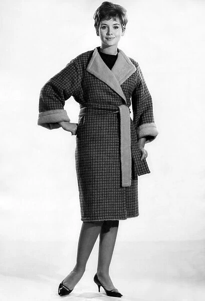 Model Anne Cave wearing a dressing gown. November 1962