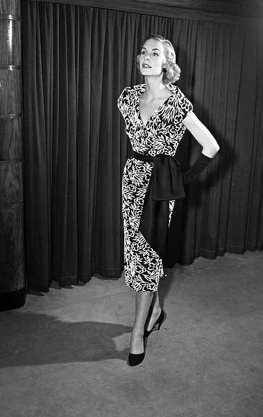 Model Audrey Wordsworth models a cocktail dress. 21st May 1954