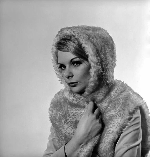 Model Bianca Foakes seen here modeling fur coat in the Reveille Studio. 1964