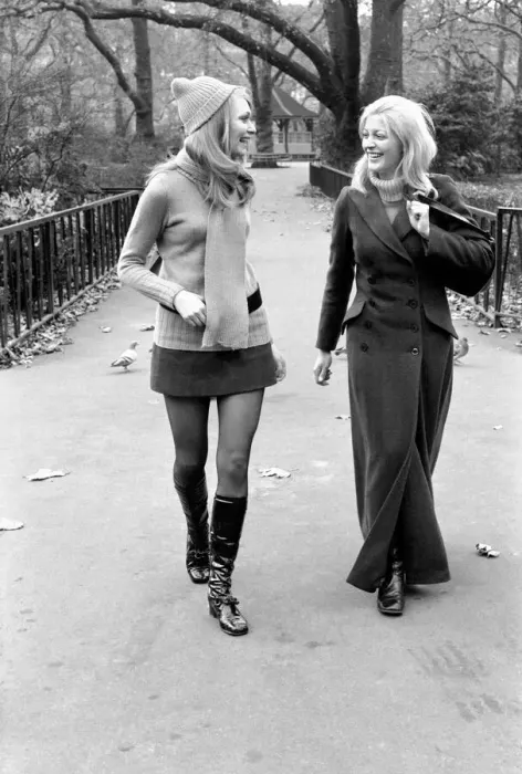 Framed Print : Model Blanche Webb wearing mini skirt and knee high boots with model Monica Hahn wearing Framed Print : Model Blanche Webb wearing mini skirt and knee high boots with model Monica Hahn wearing