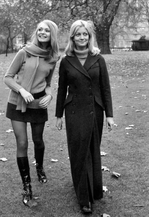 Framed Print : Model Blanche Webb wearing mini skirt and knee high boots with model Monica Hahn wearing Framed Print : Model Blanche Webb wearing mini skirt and knee high boots with model Monica Hahn wearing