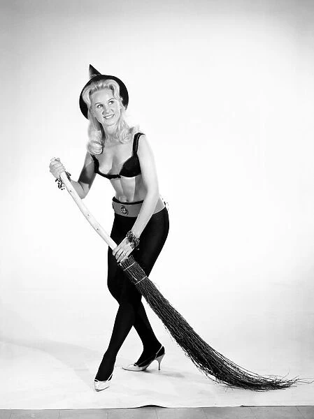 Model Brenda Bartlet dressed as a witch. October 1959