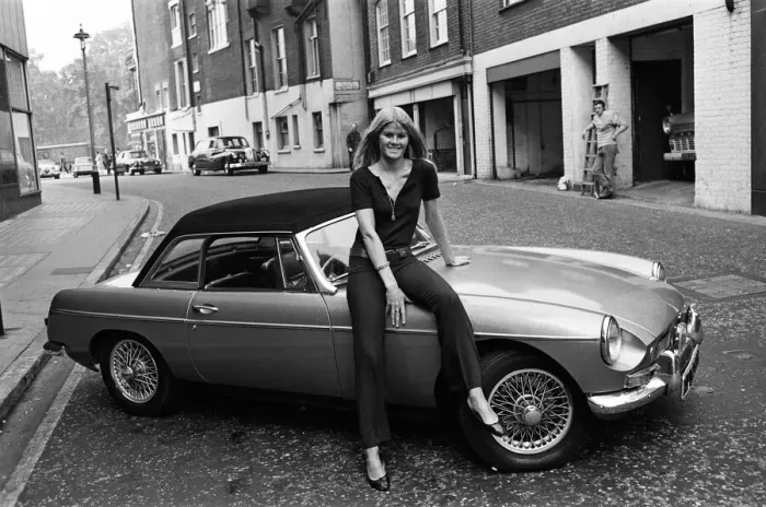 Framed Print : Model Charlotte Anne Curzon, aged 21, bought herself an MGB car
