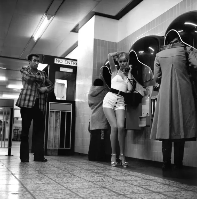 Framed Print : Model Christine Donna seen here using the public telephones at Holborn tube station
