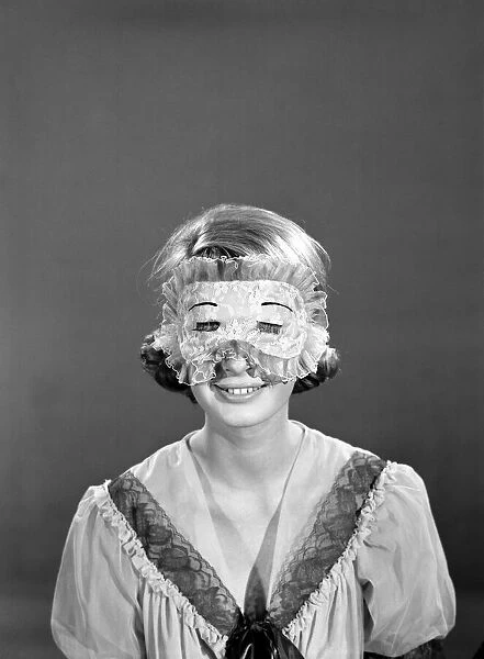 Model Dawn Chapman wearing face mask to aid her in getting a good nights sleep. 1962