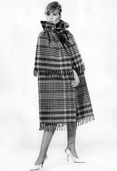 Model Dawn Chapman wearing tartan patterned outfit. Ocotober 1962 P008896