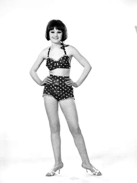 Framed Print : Model, Debbie Attwood, poses in the latest beachwear fashion, Studio Pix, 1963