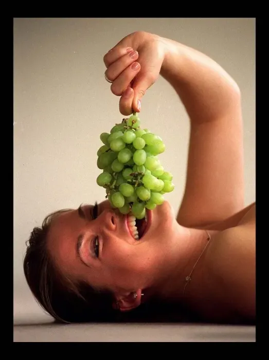 Framed Print : Model eating grapes March 1998 Framed Print : Model eating grapes March 1998