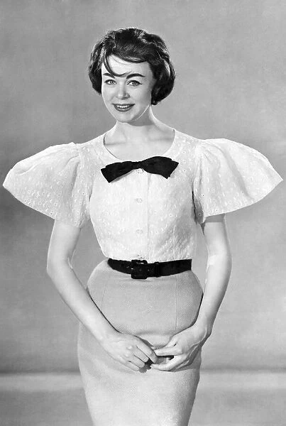 Model Jackie Jackson wearing blouse and skirt. June 1959 P006969