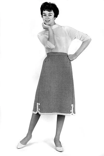 Model Jackie Jackson wearing plain top and lonk skirt. September 1960 P009001