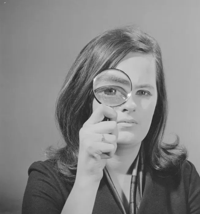 Framed Print : Model Jennie Cropp with magnifying glass