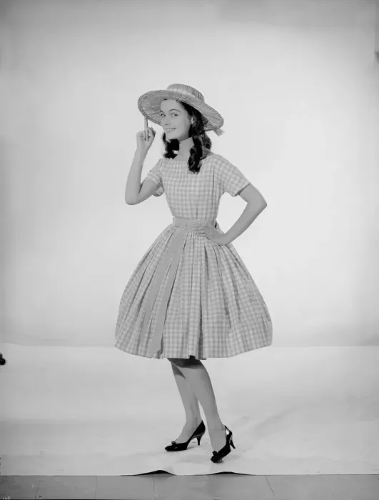 Framed Print : Model Jennifer Goddard. Brown-haired girl in checkered dress with hat Framed Print : Model Jennifer Goddard. Brown-haired girl in checkered dress with hat