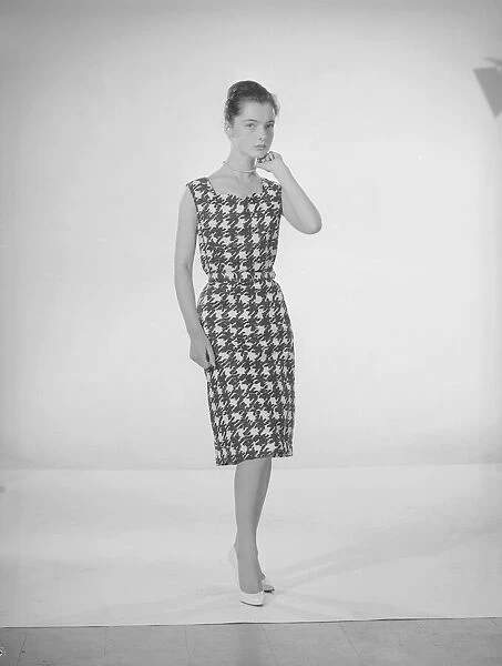 Model Jennifer Goddard. Young woman in houndstooth dress